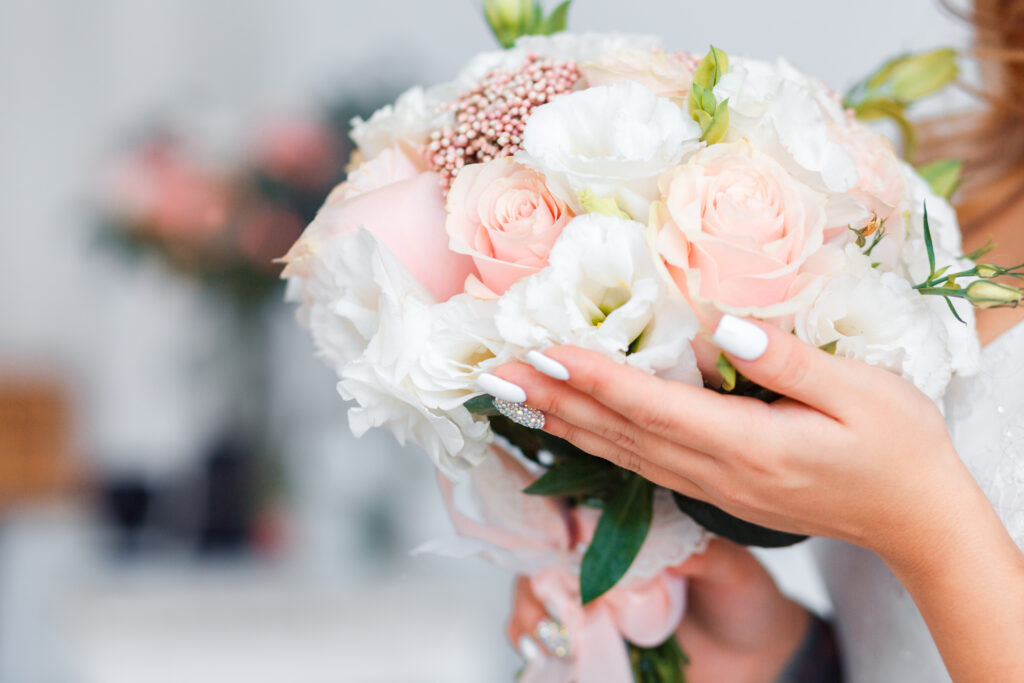 Delicate classic white wedding flowers for the bride